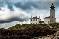 Beavertail Lighthouse Sits Atop Unique Rock Formations Under Sto